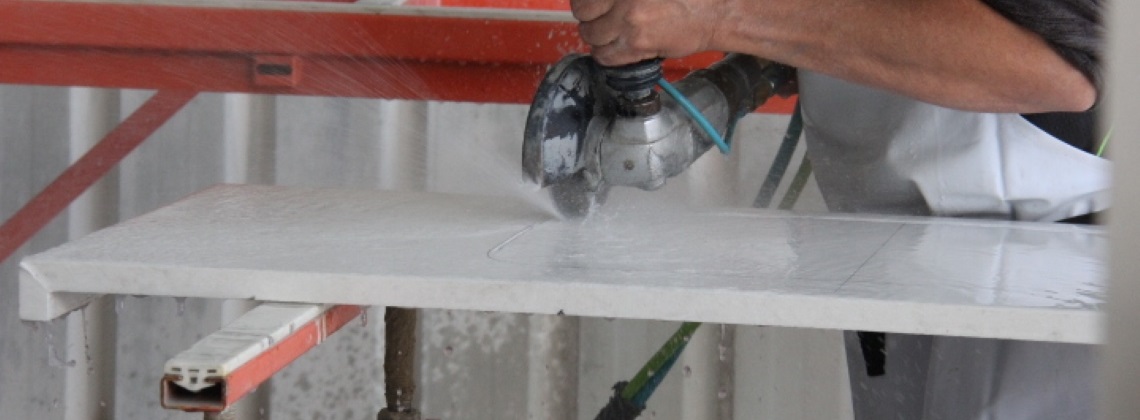 Image showing the wet cutting of engineered stone